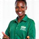 A smiling, uniformed cleaning staff member demonstrating professionalism and cleanliness.